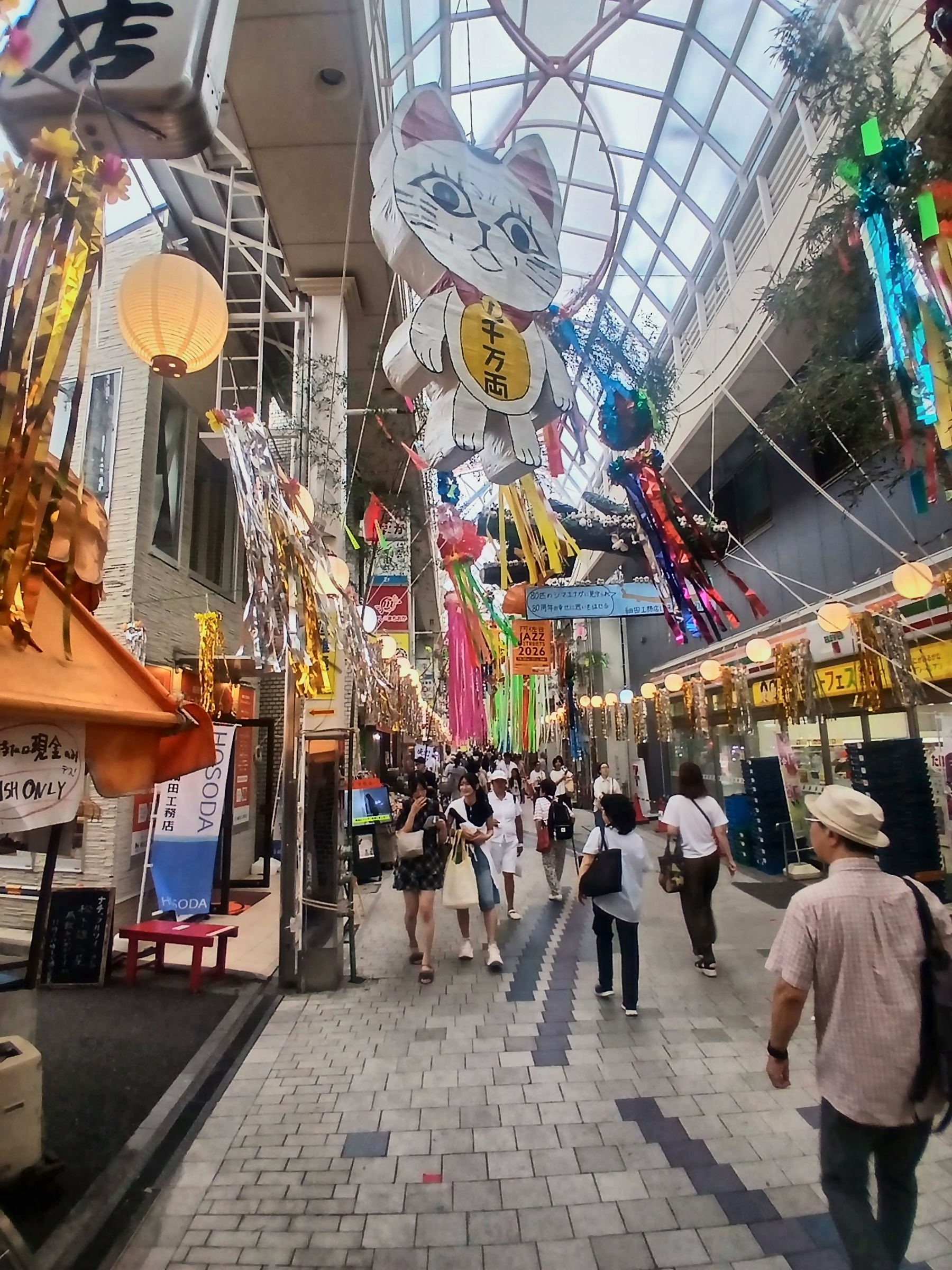 View of the Pearl Center with a giant lucky cat hanging overhead
