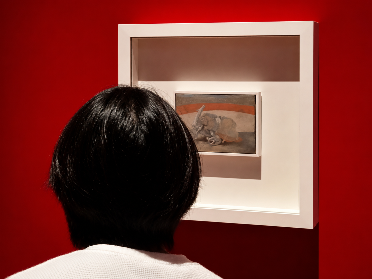 A visitor looks closely at Picasso's bullfighting works